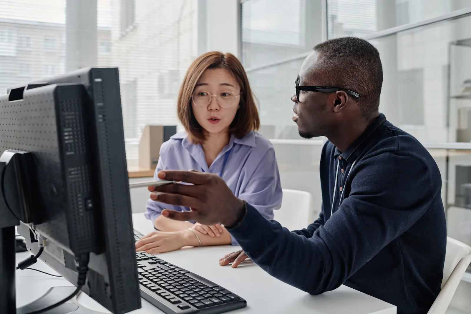 A developer talking a colleague through the software on screen